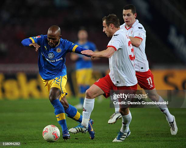 Matthias Lehmann of Cologne and Dominik Kumbela of Braunschweig battle for the ball during the Bundesliga match between 1. FC Koeln and Eintracht...