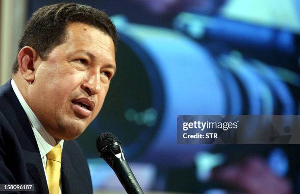 Venezuelan President Hugo Chavez answers questions during a press conference at the Presidential Palace in Caracas, 13 February 2004. Chavez...