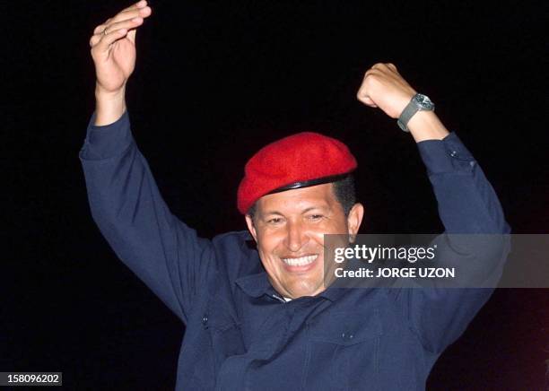 Venezuelan President Hugo Chavez gestures and greets supporters as he arrives for a campaign closing rally 26 July in Caracas. The elections are...