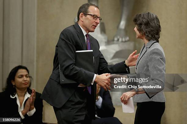 Department of Justice Appellate Section Deputy Chief Kathleen Felton is congratulated by Assistant Attorney General for the Criminal Division Lanny...