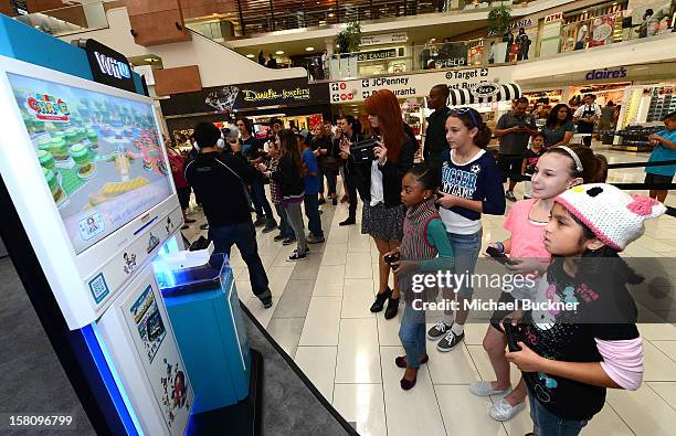 Debby Ryan and Skai Jackson stars of Disney XD’s hit series "Kickin’ It" gets ready to battle in the Wii U Showdown at Westfield Century City Mall in...