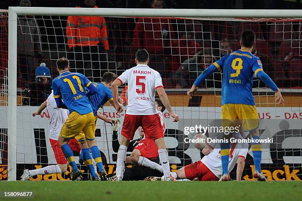 Ermin Bicakcic of Braunschweig scores his team's second goal during the Bundesliga match between 1. FC Koeln and Eintracht Braunschweig at...