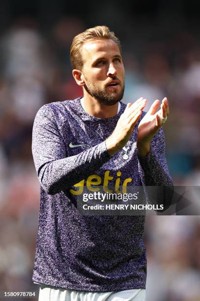 Tottenham Hotspur's English striker Harry Kane applauds fans on the pitch after the pre-season friendly football match between Tottenham Hotspur and...