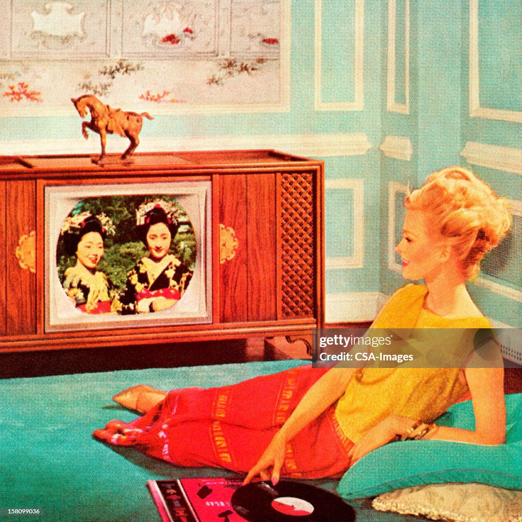 Woman Watching TV In Blue Room
