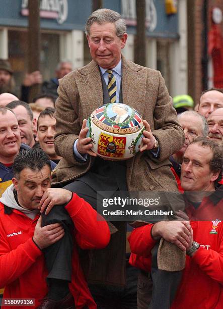 The Prince Of Wales "Turns The Ball" At The Annual Shrovetide Football Match In Ashbourne, Derbyshire. .