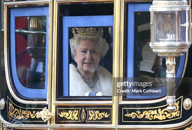 Queen Elizabeth Ii Travels From Buckingham Palace Towards The Mall Ahead Of The State Opening Of Parliament In London.