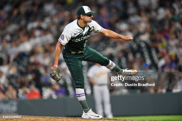 Brad Hand of the Colorado Rockies pitches in the ninth inning of a game against the Oakland Athletics at Coors Field on July 29, 2023 in Denver,...