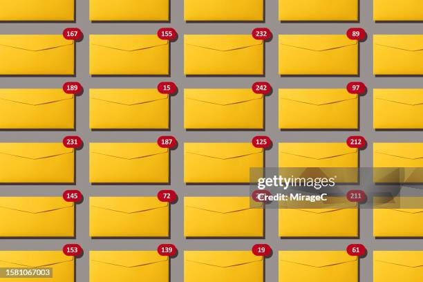 lots of unread email notifications of yellow envelopes - abundance stock pictures, royalty-free photos & images