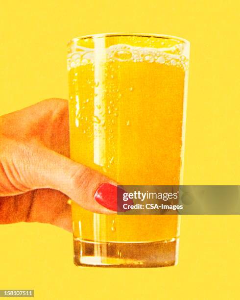 bildbanksillustrationer, clip art samt tecknat material och ikoner med woman's hand holding glass of orange juice - studio shot