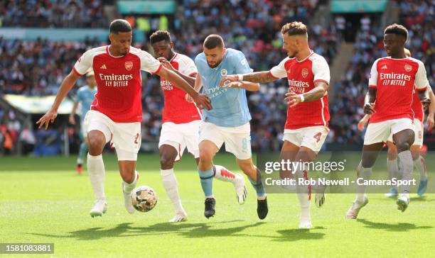 Manchester City's Mateo Kovacic bursts into the Arsenal penalty area under pressure from Arsenal's William Saliba, Ben White and Thomas Partey during...