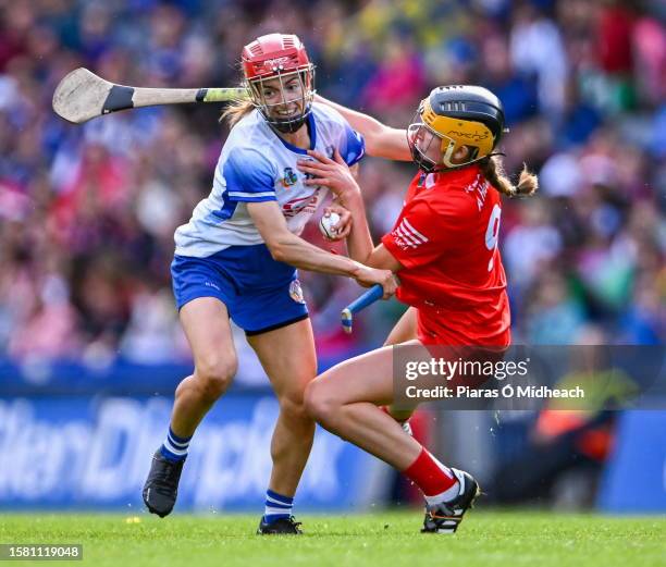Dublin , Ireland - 6 August 2022; Lorraine Bray of Waterford in action against Aoife Healy of Cork during the Glen Dimplex All-Ireland Camogie...