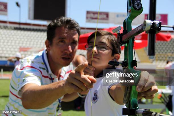 File photo dated July 06, 2013 shows Turkish archer Mete Gazoz competes during the 'Youth and Stars Archery Turkiye Championship' organized by the...