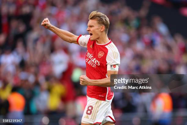 Arsenal's Martin Odegaard celebrates after he scores a penalty during the penalty shootoutl during The FA Community Shield match between Manchester...