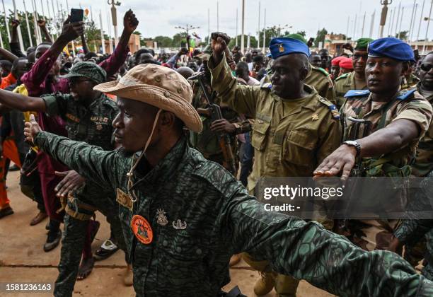 Niger's National Council for the Safeguard of the Homeland Colonel-Major Amadou Abdramane is greeted by supporters upon his arrival at the Stade...