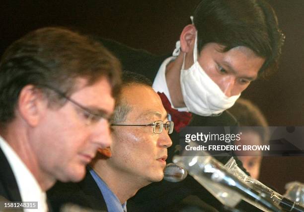 Dr. Keiji Fukuda of the World Health Organisation has his microphone adjusted during a briefing in a Beijing hotel, 13 May 2003. Beijing authorities...