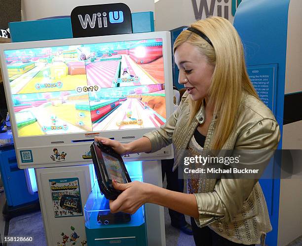 Peyton List star of Disney Channel’s hit series "Jessie" battle in the Wii U Showdown at Westfield Century City Mall in Los Angeles on December 9,...