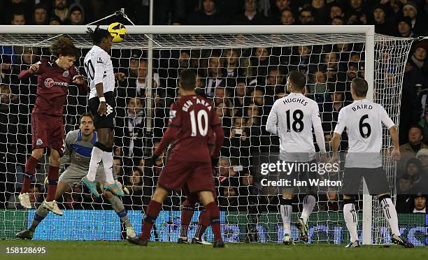 Hugo Rodallega of Fulham heads in their second goal during the Barclays Premier League match between Fulham and Newcastle United at Craven Cottage on...