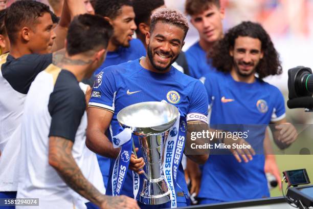 Reece James of Chelsea celebrates with the Summer Series trophy after their victory in the Premier League Summer Series match between Chelsea FC and...