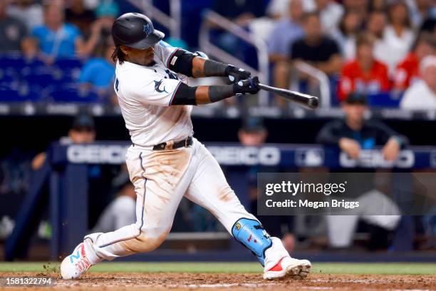 Jean Segura of the Miami Marlins hits a home run against the Detroit Tigers during the eighth inning of the game at loanDepot park on July 30, 2023...