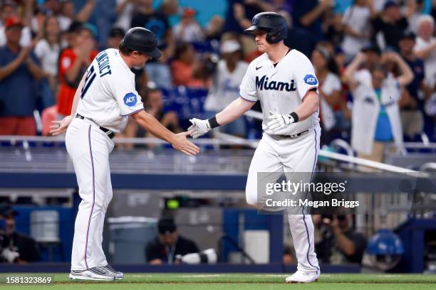 Garrett Cooper of the Miami Marlins rounds the bases after hitting a home run against the Detroit Tigers during the seventh inning at loanDepot park...