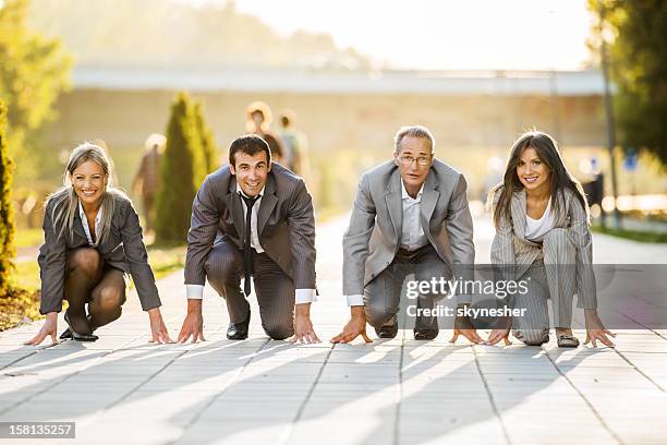 businesspeople on a starting line, ready to run - sport manager stock pictures, royalty-free photos & images