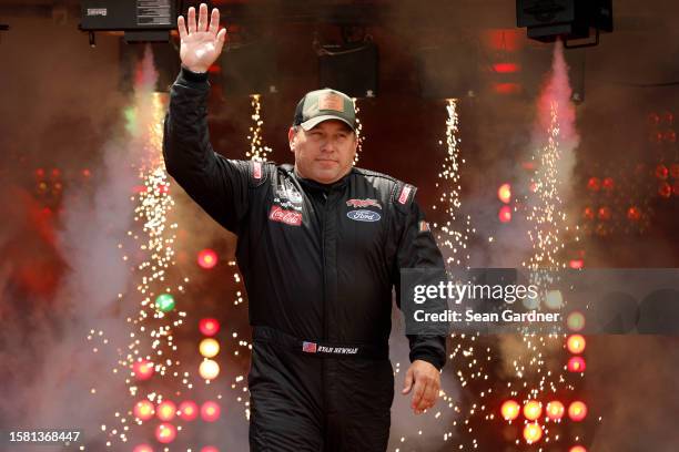 Ryan Newman, driver of the Parts Plus/Biohaven Ford, waves to fans as he walks onstage during driver intros prior to the NASCAR Cup Series Cook Out...