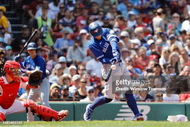 George Springer of the Toronto Blue Jays connects on a double against the Boston Red Sox during the third inning at Fenway Park on August 6, 2023 in...