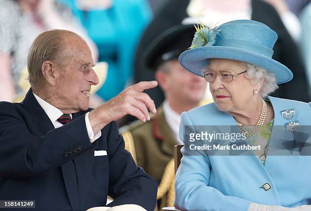 Queen Elizabeth Ii And The Prince Philip The Duke Of Edinburgh Watch A Flotilla Of Boats Celebrating The History Of The River Thames At The Henley...