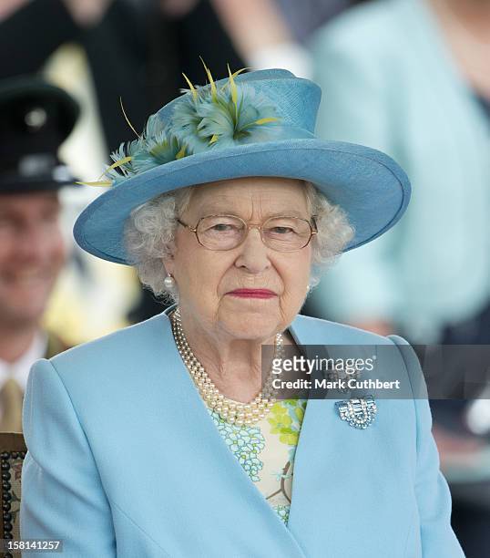Queen Elizabeth Ii Watches A Flotilla Of Boats Celebrating The History Of The River Thames At The Henley Business School In Oxfordshire.