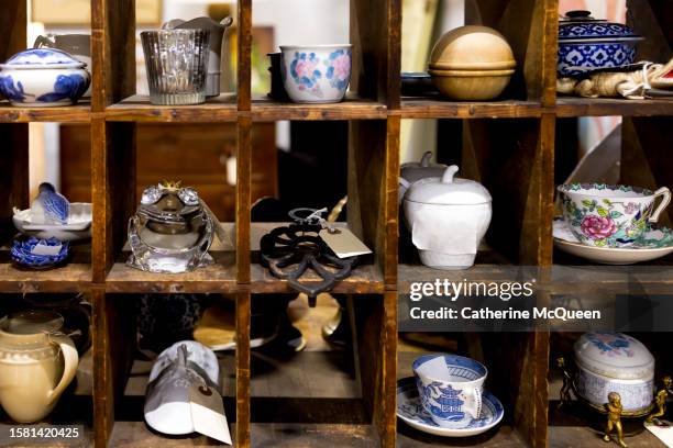 antique knick knacks in cubby hole compartments at vintage flea market - second hand stock pictures, royalty-free photos & images