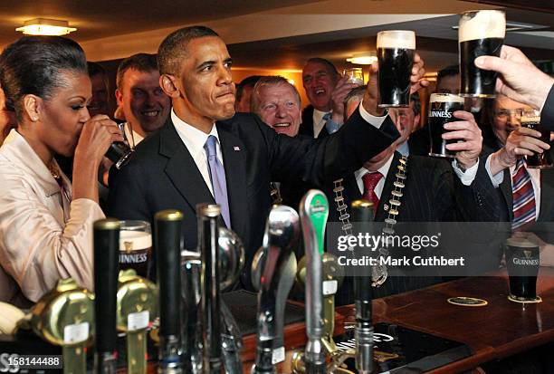 President Barack Obama And First Lady Michelle Obama Enjoy A Pint Of Guinness At Hayes Bar In His Ancestral Home Moneygall, Co Offaly During...