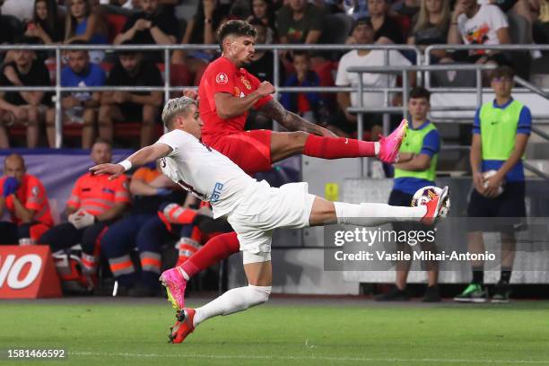 Florinel Coman of FCSB fights for the ball with Cristian Manea of CFR Cluj during the SuperLiga Round 4 match between FCSB and CFR Cluj at Stadionul...