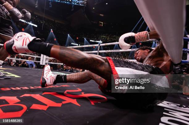 Errol Spence Jr. Is knocked down by Terence Crawford during round 7 of their World Welterweight Championship bout at T-Mobile Arena on July 29, 2023...