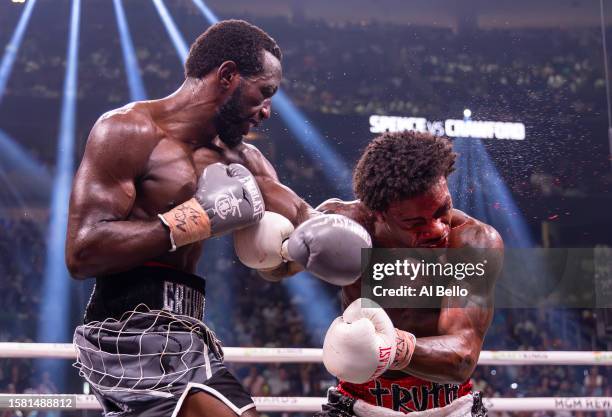 Terence Crawford punches Errol Spence Jr. During round 7 of their World Welterweight Championship bout at T-Mobile Arena on July 29, 2023 in Las...