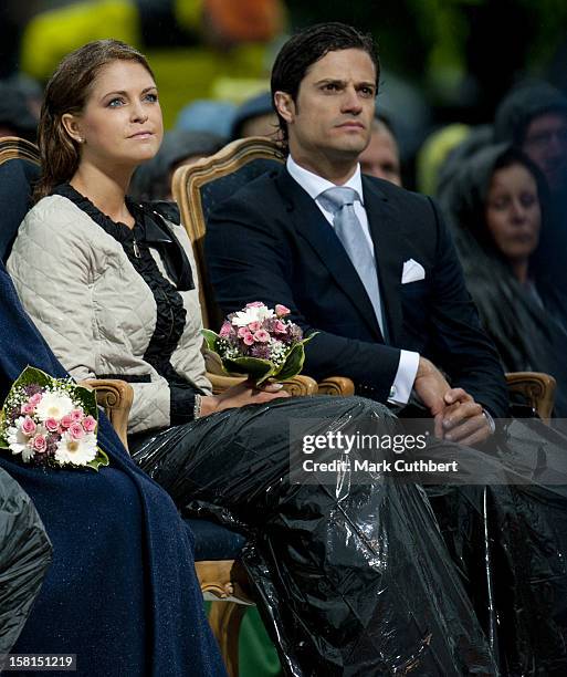 Princess Madeleine Of Sweden And Prince Carl Philip Of Sweden Use Binliners To Keep Themselves Dry During Princess Victoria Of Sweden'S 34Th Birthday...