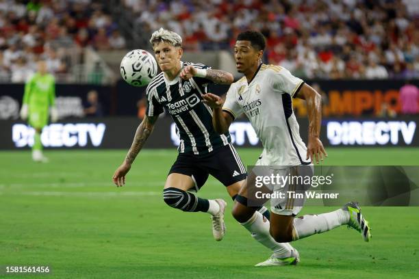 Jude Bellingham of Real Madrid battles with Alejandro Garnacho of Manchester United to control the ball in the first half during the 2023 Soccer...