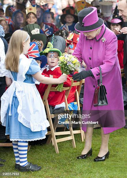 Hm Queen Elizabeth Ll And Duke Of Edinburgh Visit Sherborne Abbey And Visit A Mad Hatters Tea Party Attended By Local School Children Complete With...