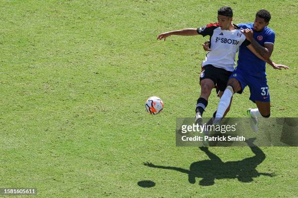 Raul Jimenez of Fulham battles for possession with Levi Colwill of Chelsea during the Premier League Summer Series match between Chelsea FC and...