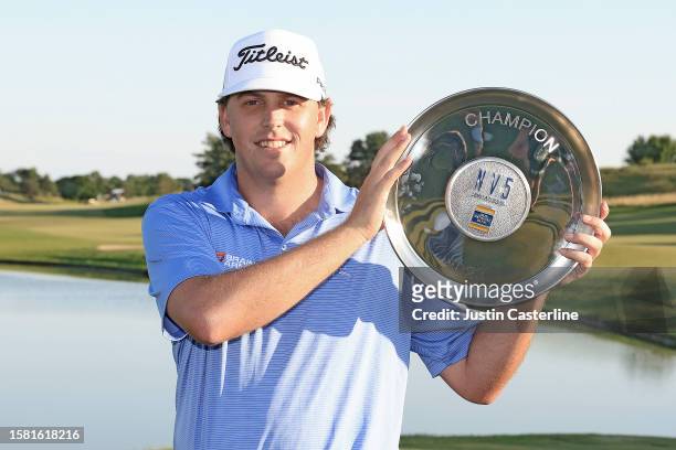 Trace Crowe of the United States poses with the NV5 Invitational trophy after winning the tournament in a two-hole playoff against Patrick Fishburn...