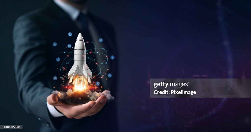 Startup, hand shows a rocket and icons