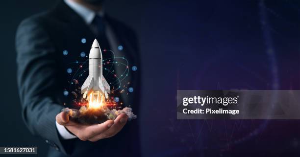 startup, hand shows a rocket and icons - taking off bildbanksfoton och bilder