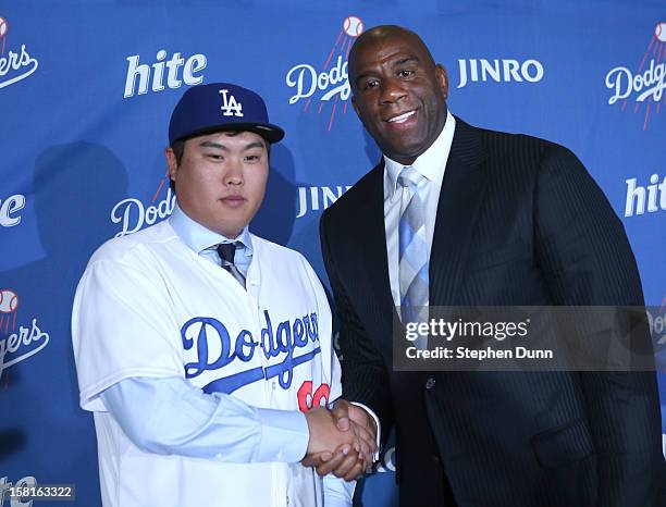 Hyun-Jin Ryu poses with Dodgers owner Ervin Magic Johnson at a press conference introducing him following his signing with the Los Angeles Dodgers at...