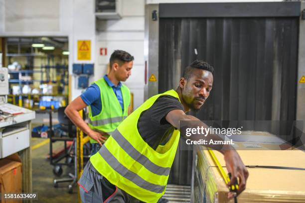 diverse airport warehouse workers inspecting cargo - unloading stock pictures, royalty-free photos & images