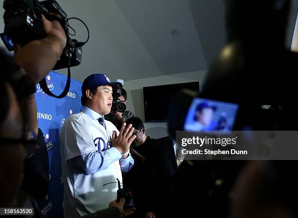 Hyun-Jin Ryu addresses the media at a press conference introducing him following his signing with the Los Angeles Dodgers at Dodger Stadium on...