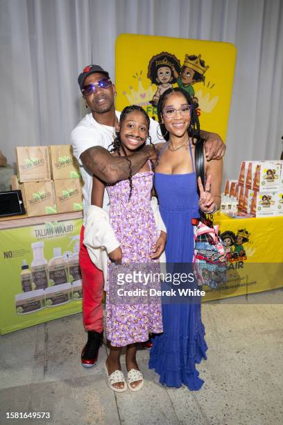 Stevie J, Eva Jordan, and Mimi Faust attend Food In The City Back To School Drive at Midtown Collective Studio on July 30, 2023 in Atlanta, Georgia.