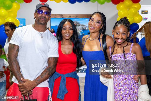 Stevie J, Jazzy McBee, Mimi Faust, and Eva Jordan attend Food In The City Back To School Drive at Midtown Collective Studio on July 30, 2023 in...