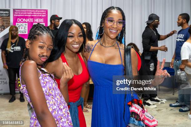 Eva Jordan, Jazzy McBee, and Mimi Faust attend Food In The City Back To School Drive at Midtown Collective Studio on July 30, 2023 in Atlanta,...