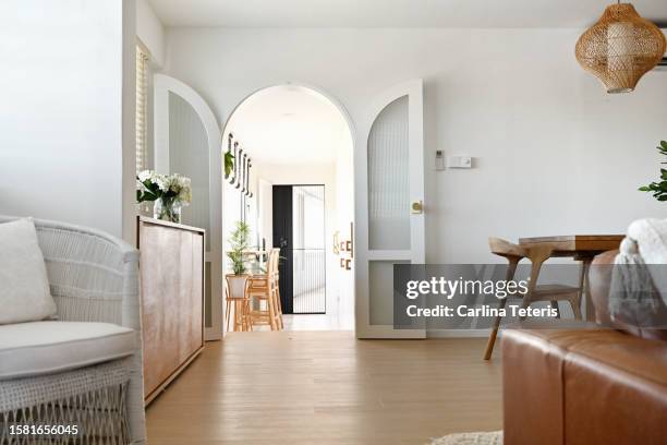 arched doorway into a modern luxury home - building entrance stock pictures, royalty-free photos & images