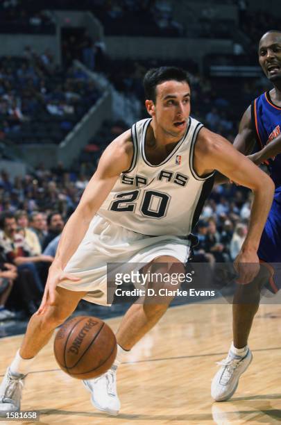 Emanuel Ginobili of the San Antonio Spurs drives to the basket during the NBA preseason game against the New York Knicks at SBC Center in San...