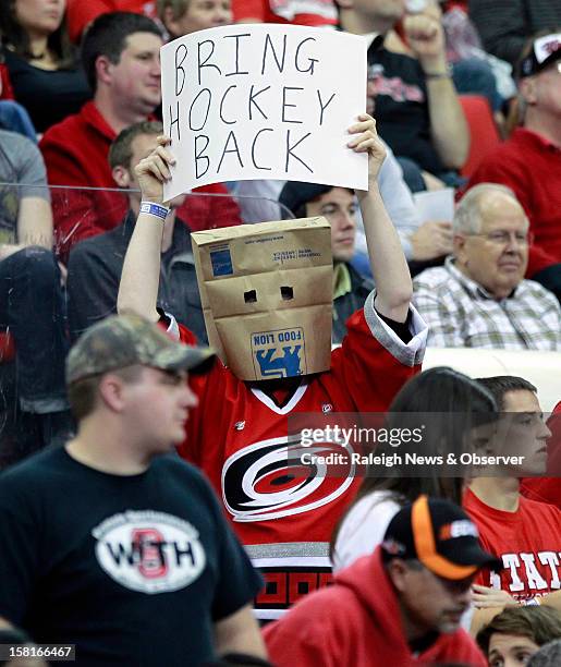 State University senior Andrew Branch shows his disapproval of the NHL lockout during Friday's N.C. State vs. UNC Asheville basketball game in...